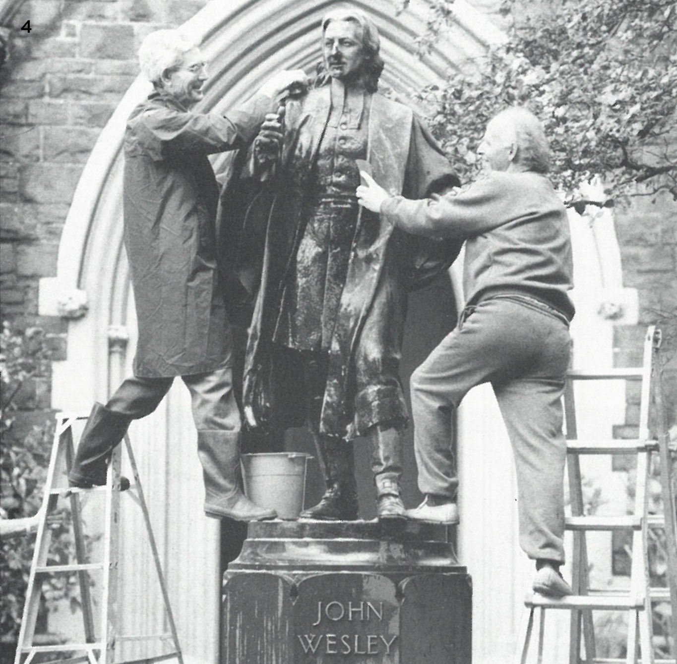 Chairperson of the Wesley Mission Geoff Cox and Kevin Green inspecting the statue.